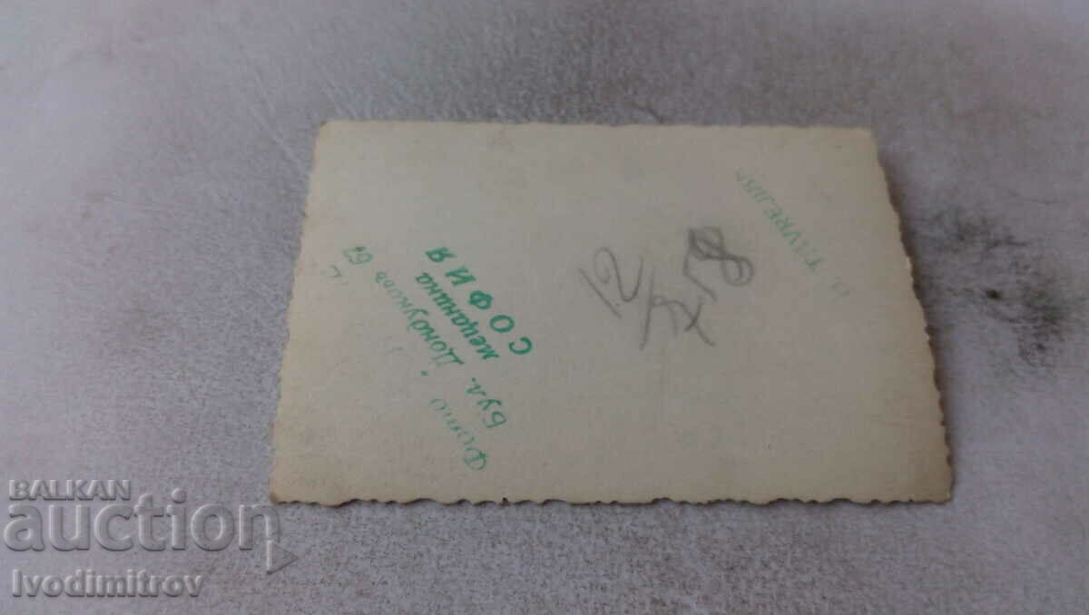 Photo Sofia A woman and three men next to a statue with price 2.35 BGN | € 1.20 Photo Sofia A woman and three men next to a statue with price 2.35 BGN | € 1.20