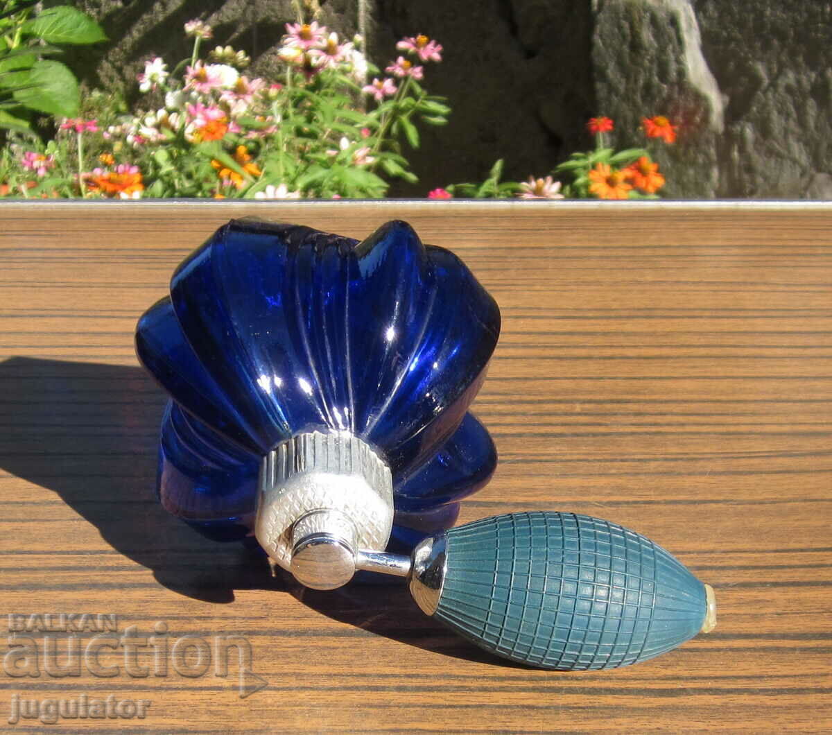 Delivery of vintage table top cobalt glass perfume bottle with pump