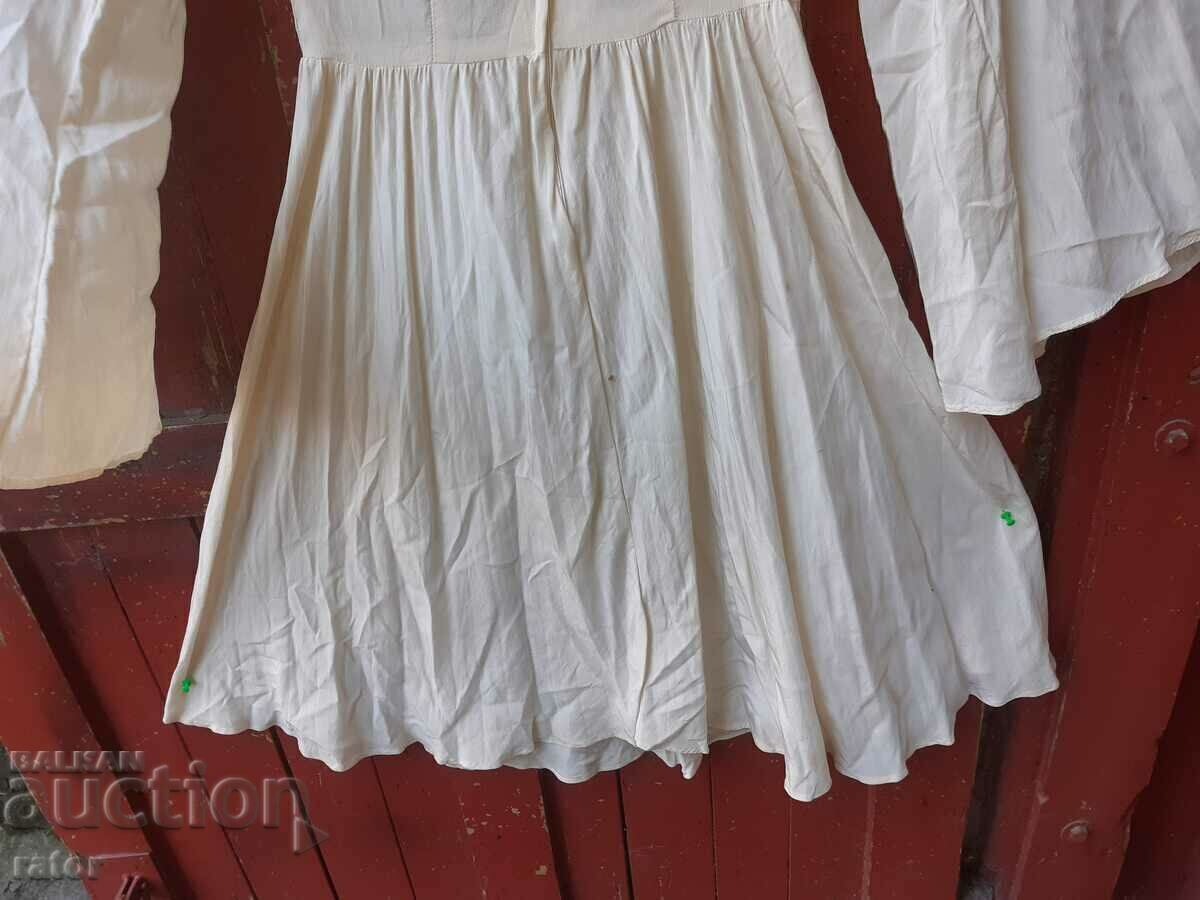 Delivery of Long white shirt. Costumes