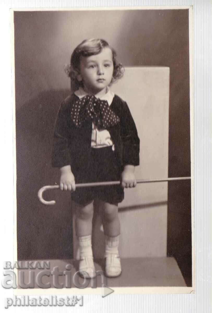 CHILD WITH A CANE photo FROM 1935.