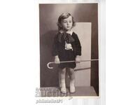 CHILD WITH A CANE photo FROM 1935.