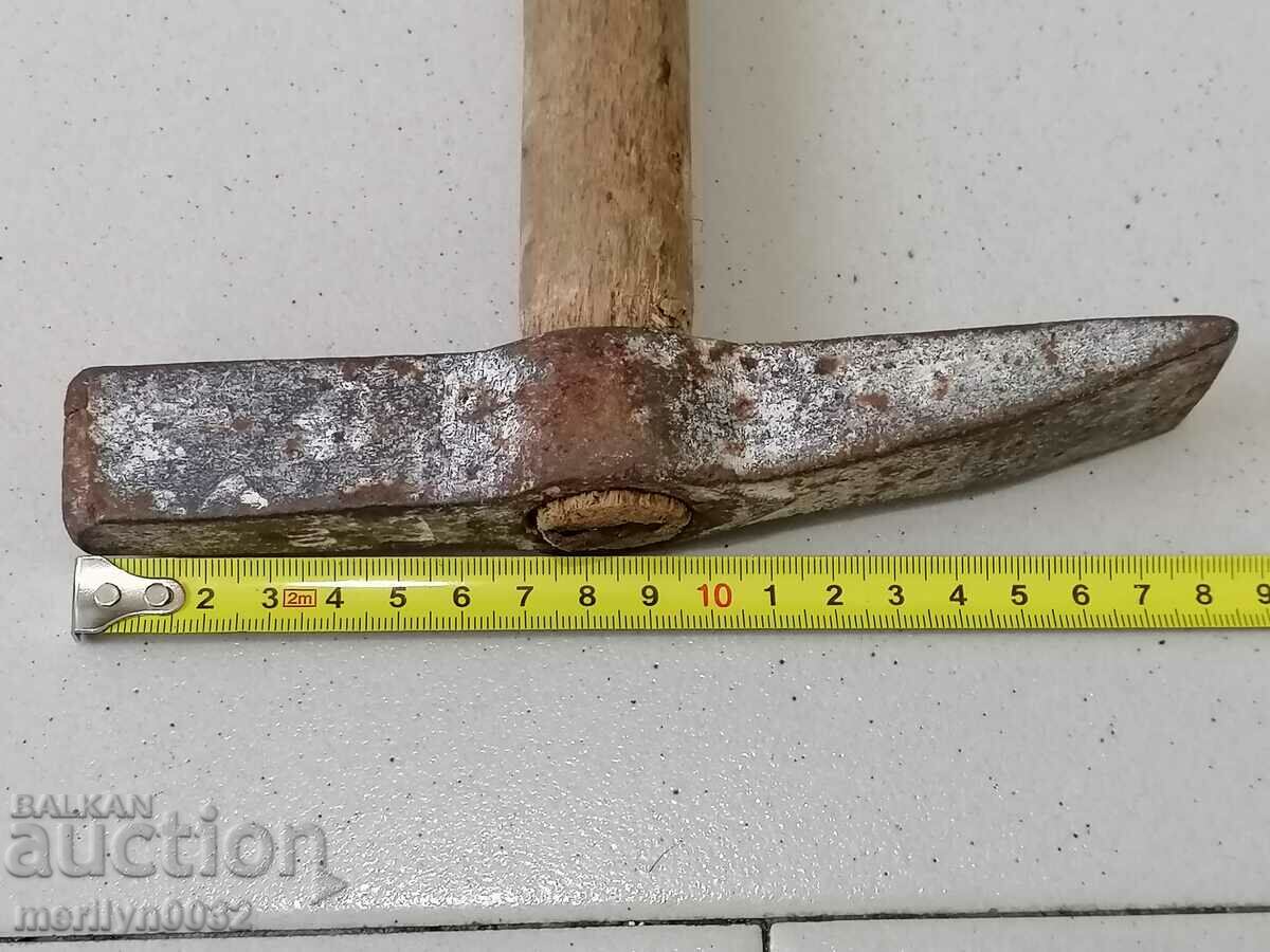 Delivery of Old wrought iron carpenter's hammer Delivery of Old wrought iron carpenter's hammer