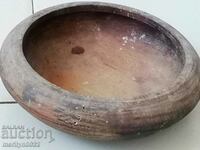 A wooden bowl, panica, a wooden pan