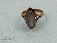 Old gold-plated ring with a violet-colored stone