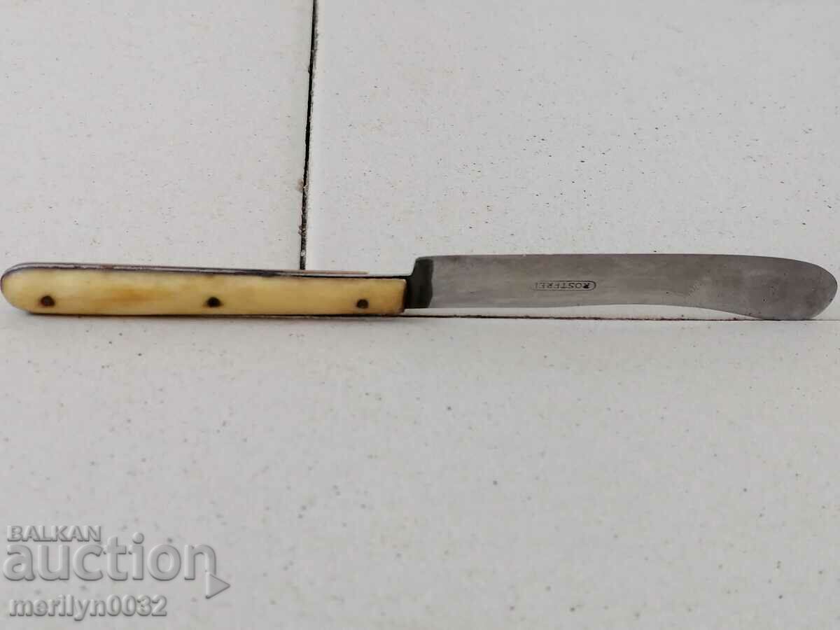 Delivery of An old household knife with horn-burnt stainless steel blade Delivery of An old household knife with horn-burnt stainless steel blade