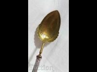 Antique spoon with silver handle