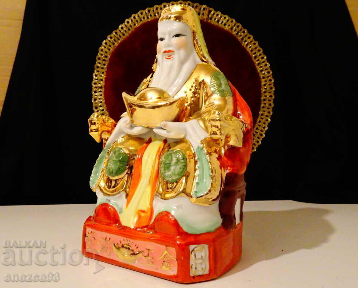 Auction Porcelain figure of a Chinese sage, gold, feng shui Auction Porcelain figure of a Chinese sage, gold, feng shui