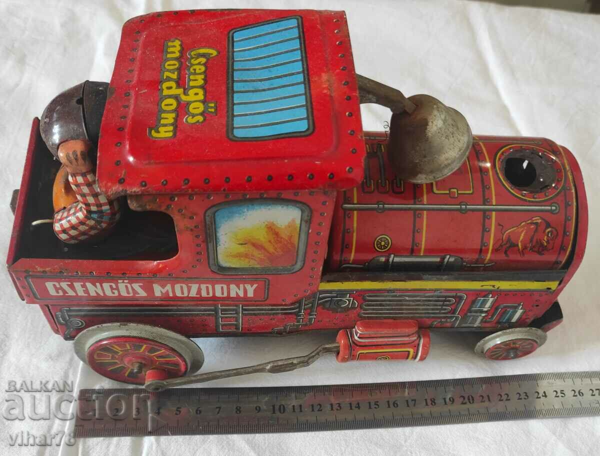 Delivery of an old tin toy Delivery of an old tin toy