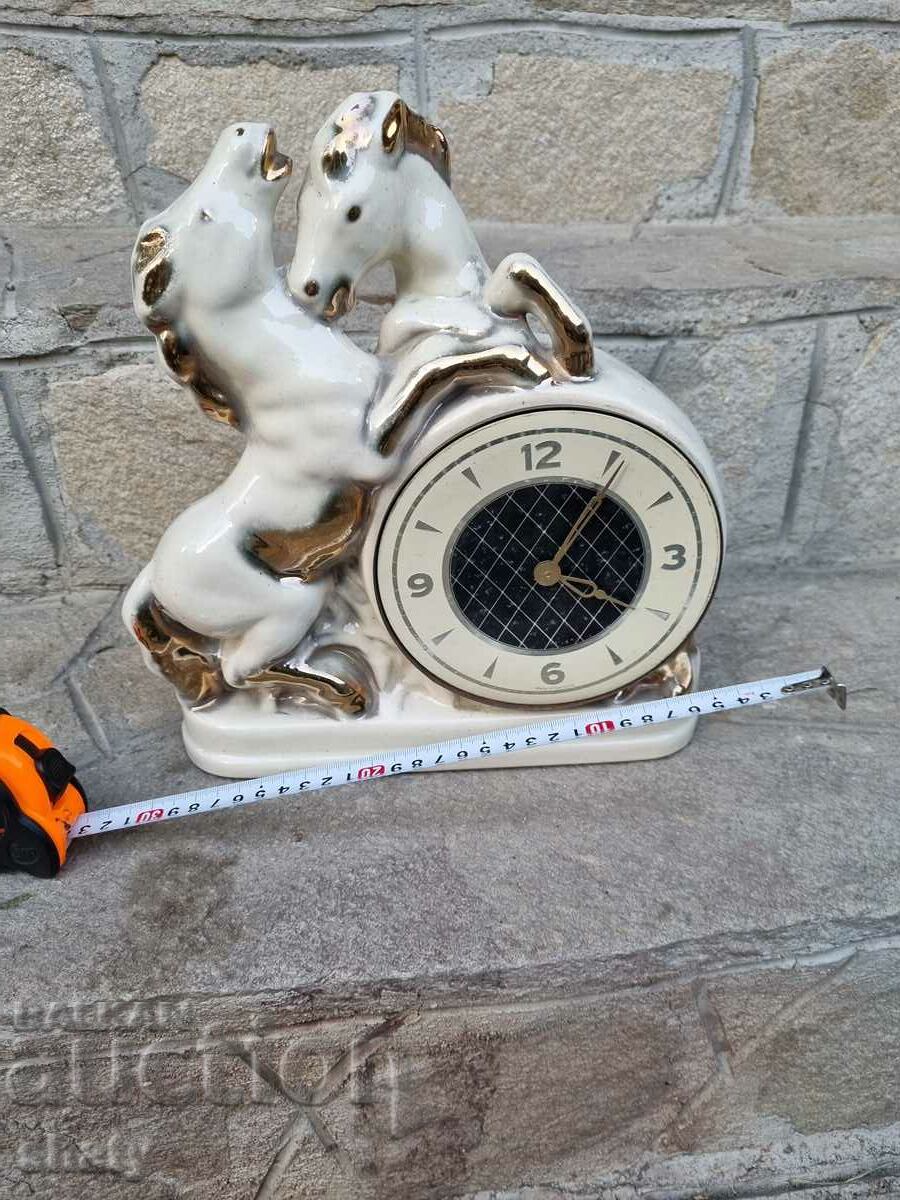 Porcelain clock. Horse sculpture