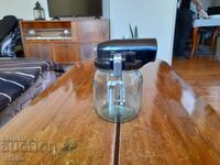 An old vacuum cleaner jar