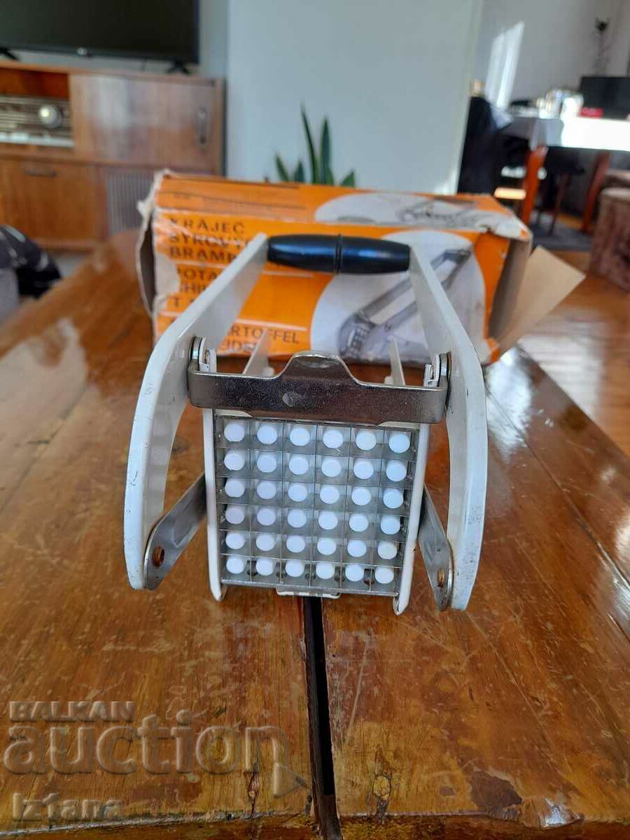 Delivery of Old kitchen appliance for cutting potatoes Delivery of Old kitchen appliance for cutting potatoes