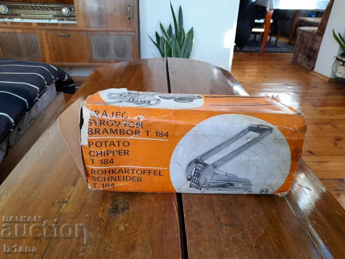 Old kitchen appliance for cutting potatoes Old kitchen appliance for cutting potatoes