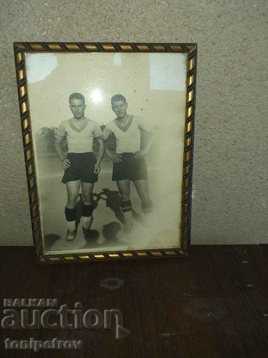 PHOTO of two football players in a frame