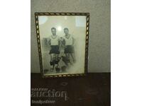 PHOTO of two football players in a frame