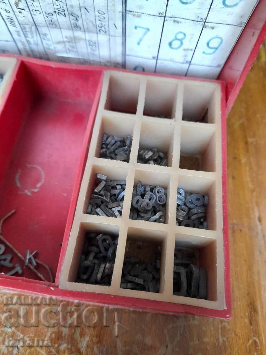 An old box with a set of metal letters and numbers - 6 An old box with a set of metal letters and numbers - 6