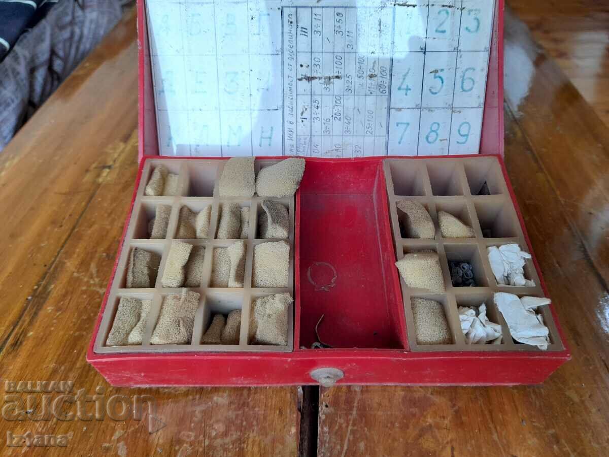 An old box with a set of metal letters and numbers - 7 An old box with a set of metal letters and numbers - 7