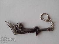 Key holder: sword.