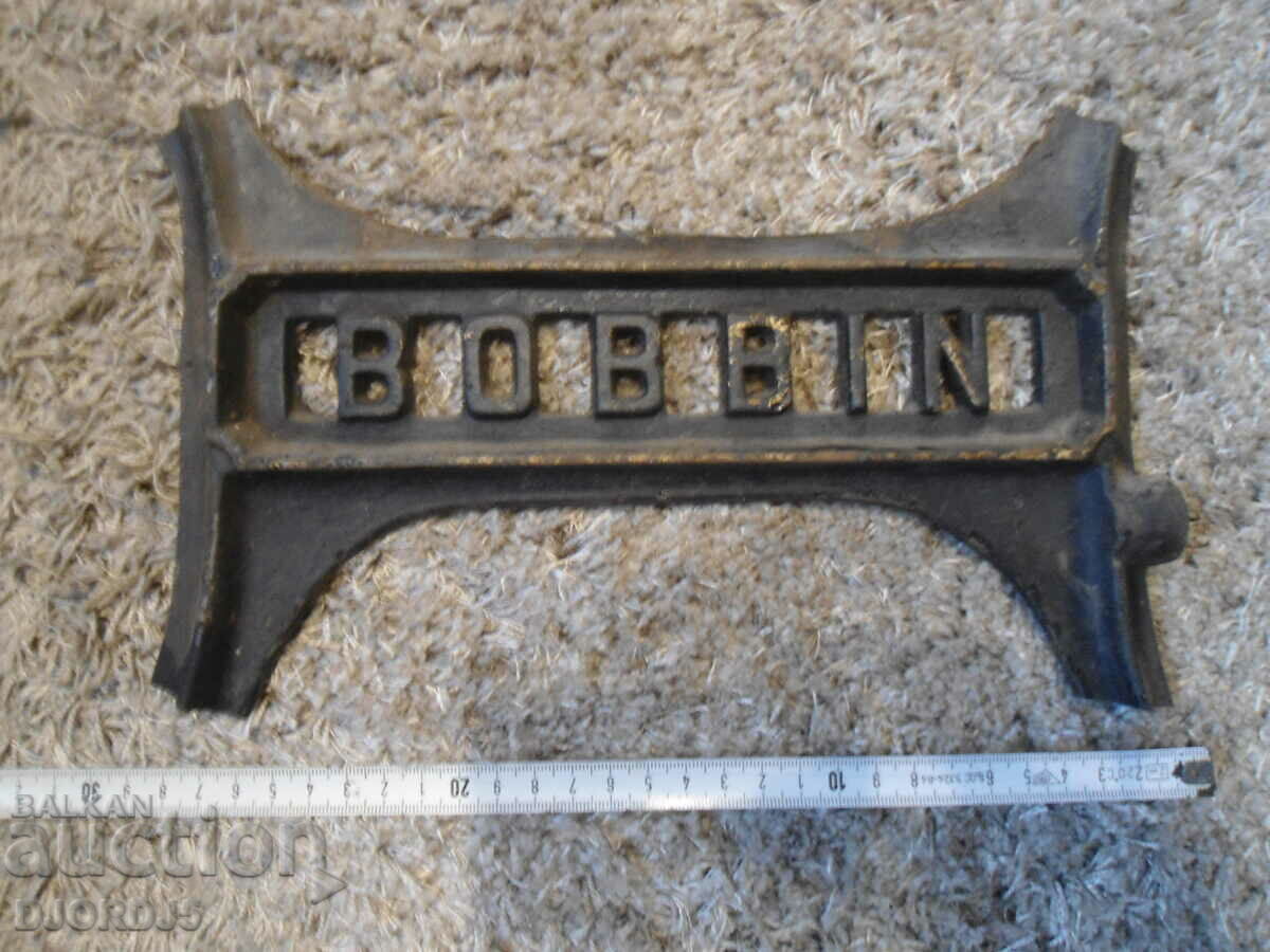 Delivery of Cast iron emblem from an old sewing machine Delivery of Cast iron emblem from an old sewing machine