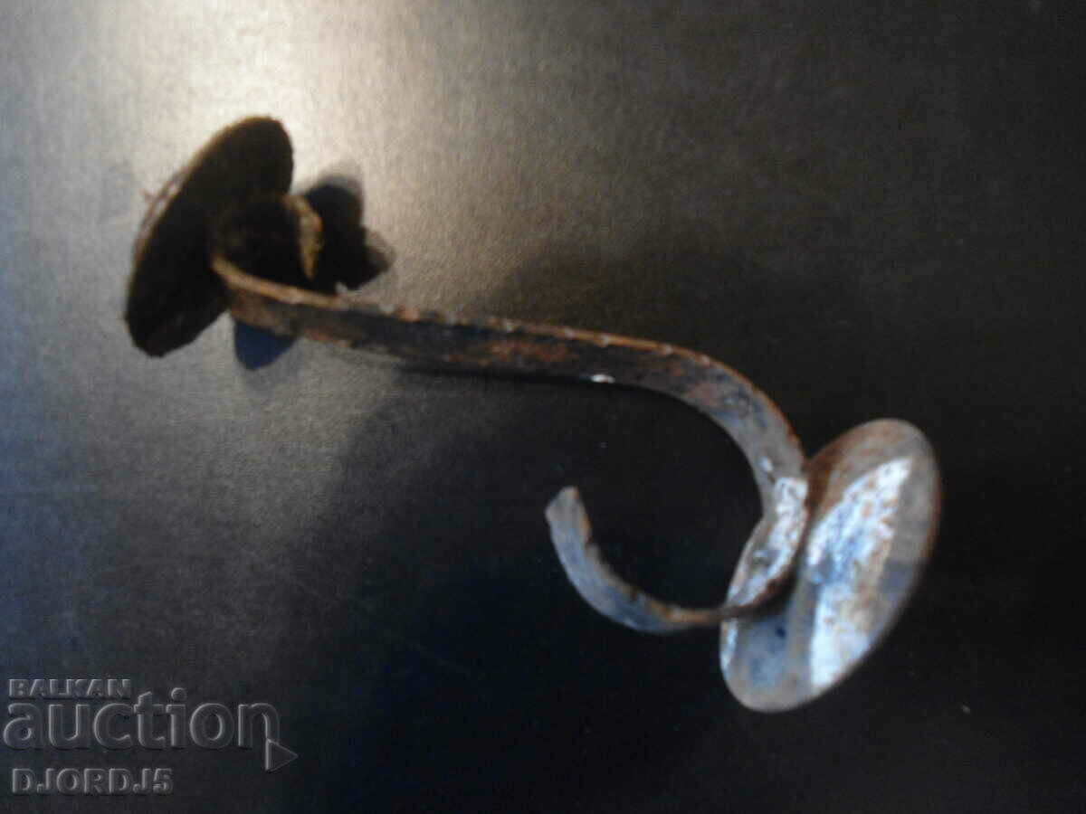 Delivery of An old forged candlestick Delivery of An old forged candlestick