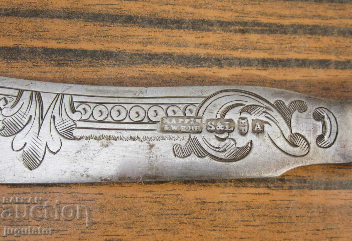 Auction antique silver knife with ornaments and ivory handle Auction antique silver knife with ornaments and ivory handle