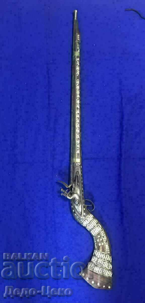 A flintlock rifle