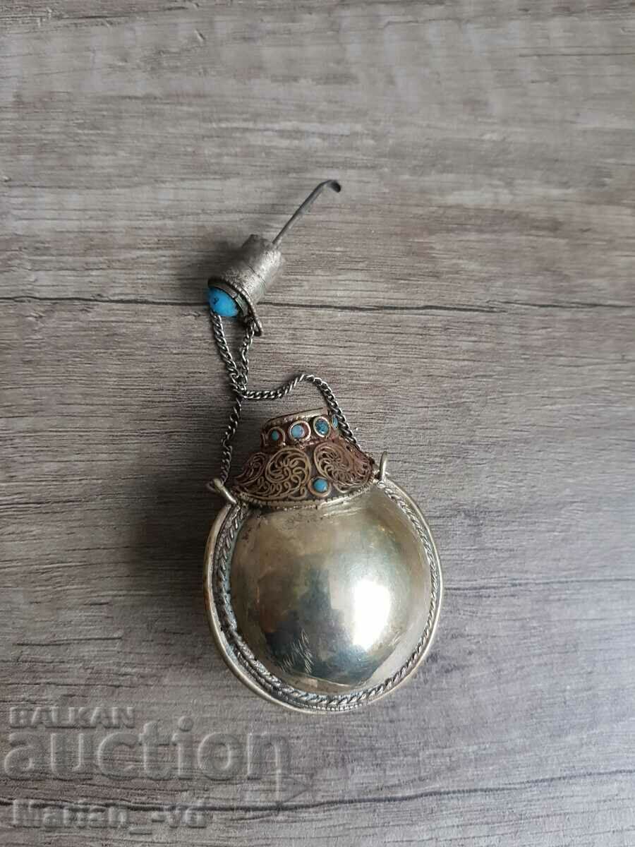 Delivery of Old metal perfume bottle