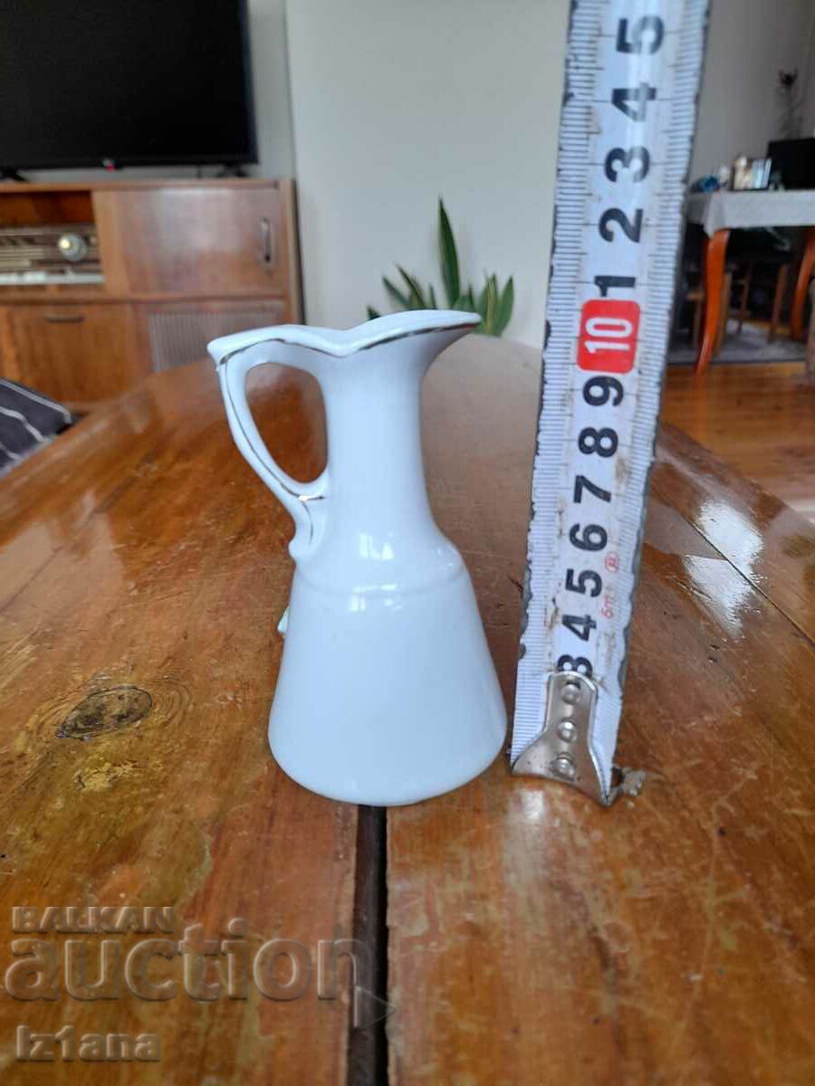 Auction  An old porcelain jug, a jug