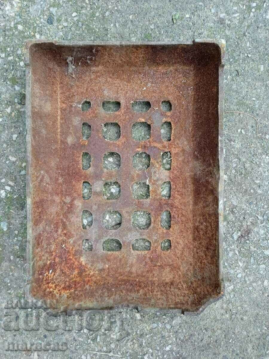 Cast iron lid from an old stove
