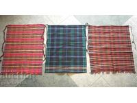 Three authentic woven costume aprons