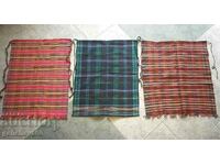 Three authentic woven costume aprons