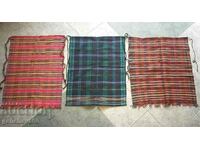 Three authentic woven costume aprons