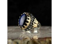 Дамски пръстен с тъмно син топаз
