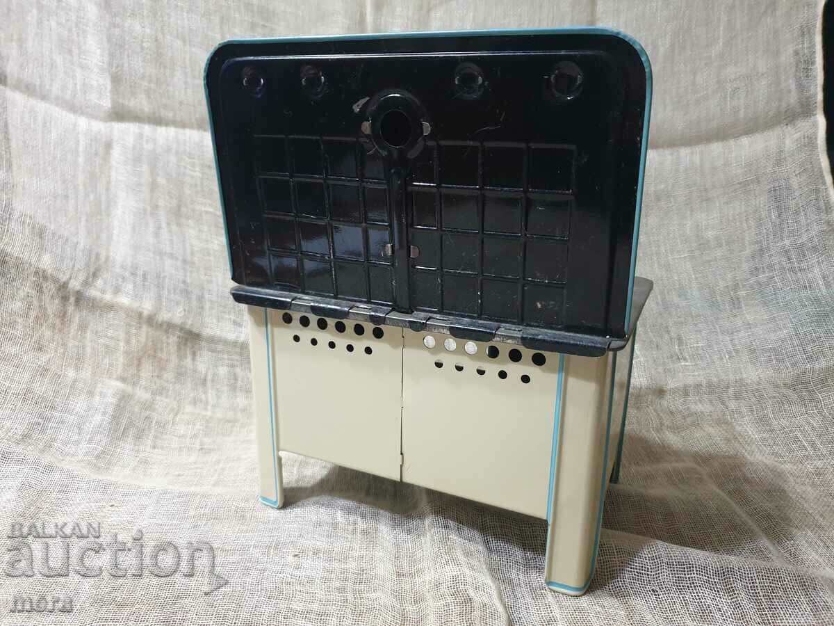 Delivery of An old metal toy - a cooking stove Delivery of An old metal toy - a cooking stove