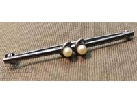 Beautiful antique silver brooch with two pearls.
