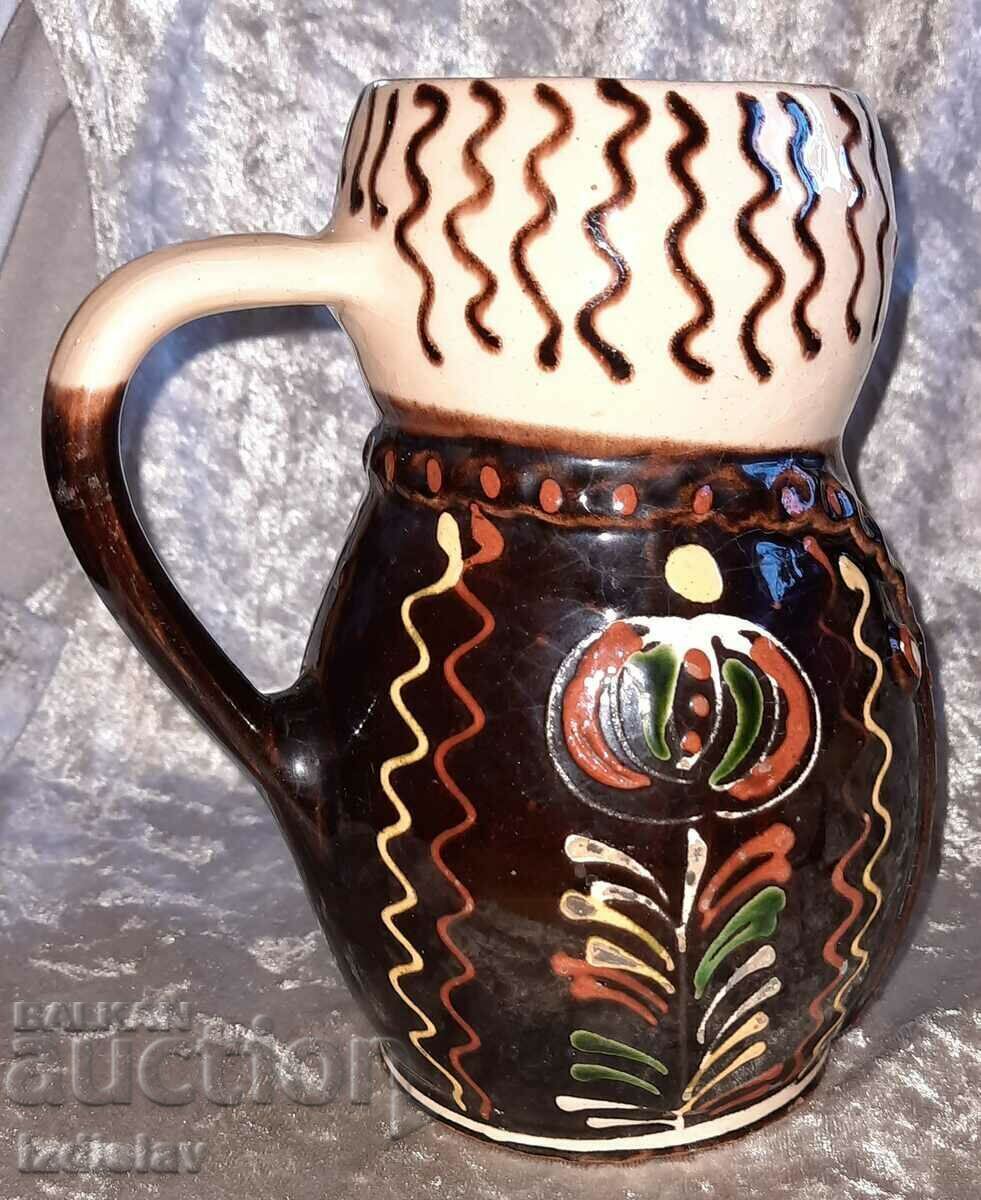 Auction Glazed ceramic jug Auction Glazed ceramic jug
