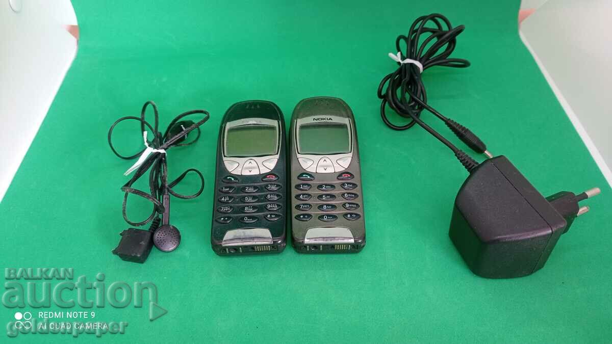 Two Nokia 6210 phones with one charger and headphones