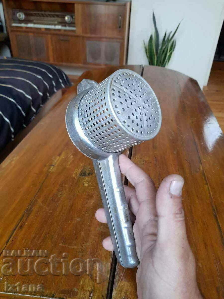 Auction Old aluminum potato press Auction Old aluminum potato press