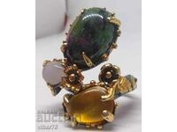 Silver ring with ruby in ziosite, amber and quartz