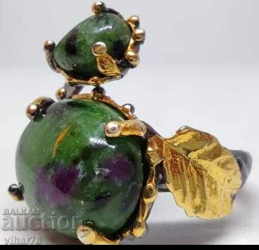 Auction  Silver ring with a ruby in ziosite