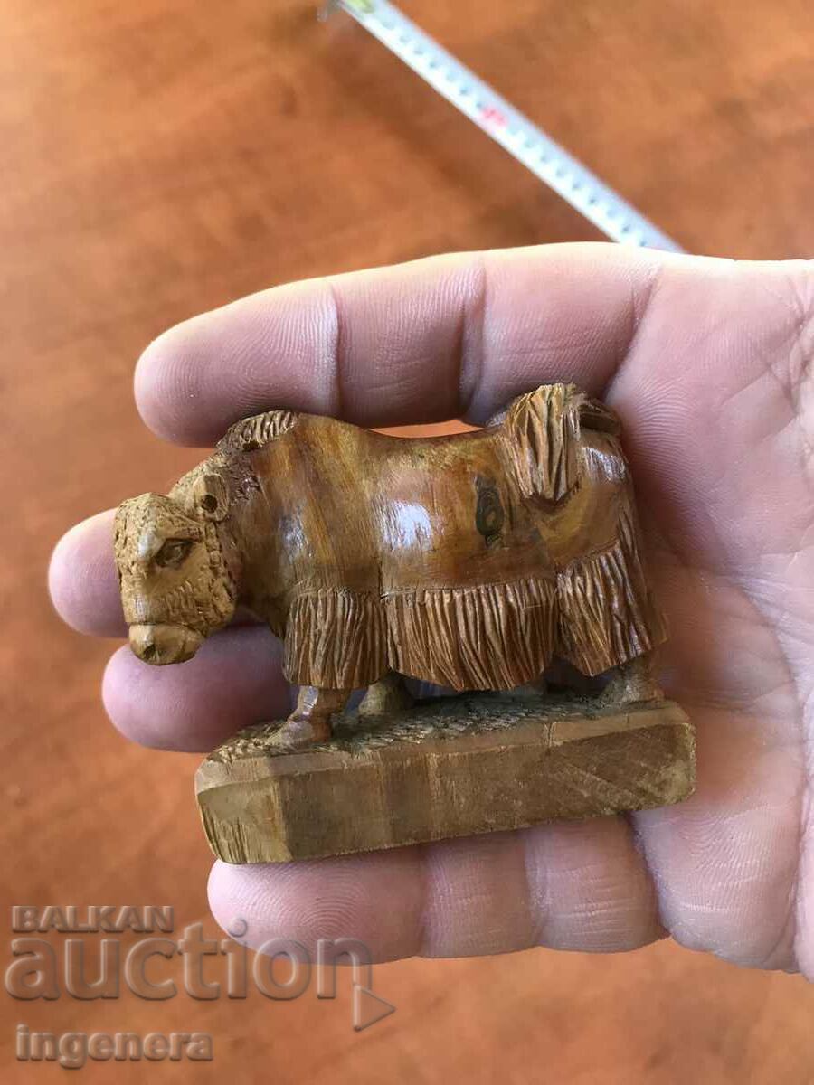 FIGURE CARVED FROM A WHOLE PIECE OF WOOD