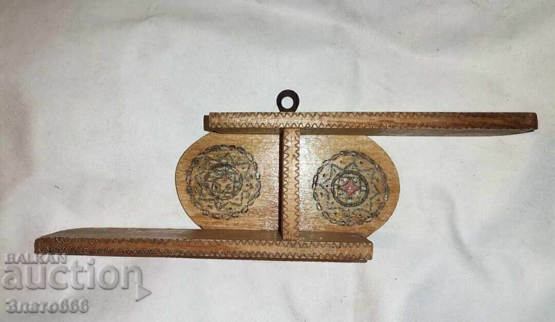 A small wooden shelf-decoration