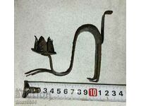 Old metal candlestick cat