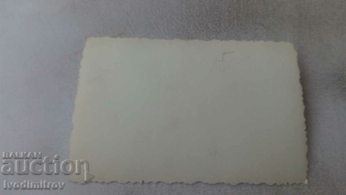 Photo Men and women in front of a new building with price 0.85 BGN | € 0.43 Photo Men and women in front of a new building with price 0.85 BGN | € 0.43