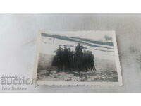 Photo Village of Polyane Young men and women by a snowbank 1934