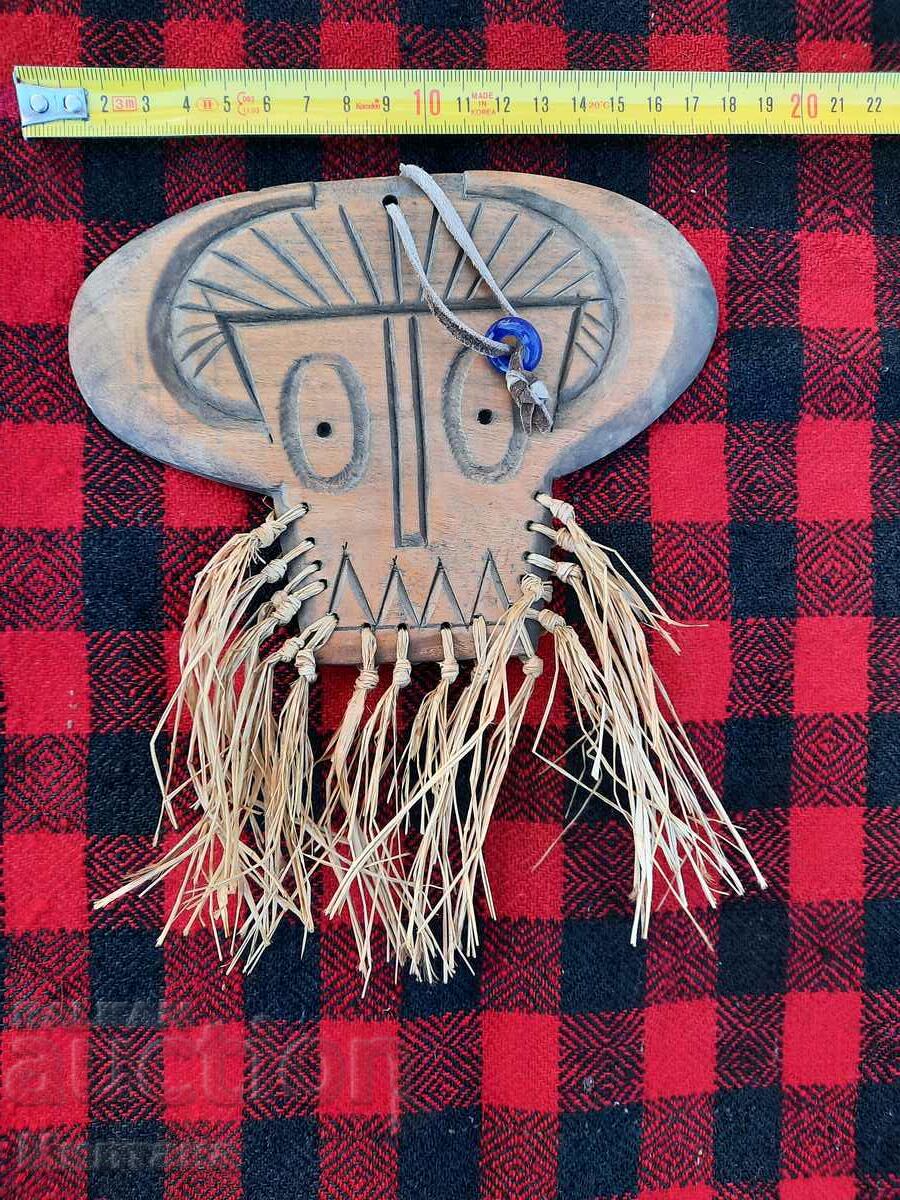 Delivery of Handmade walnut kooker mask for hanging