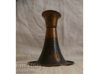 An old copper candleholder
