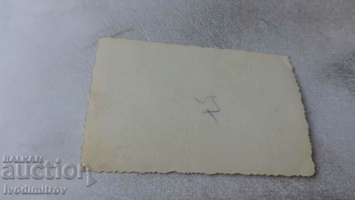 Photo Men and women in front of a building with price 0.75 BGN | € 0.38 Photo Men and women in front of a building with price 0.75 BGN | € 0.38