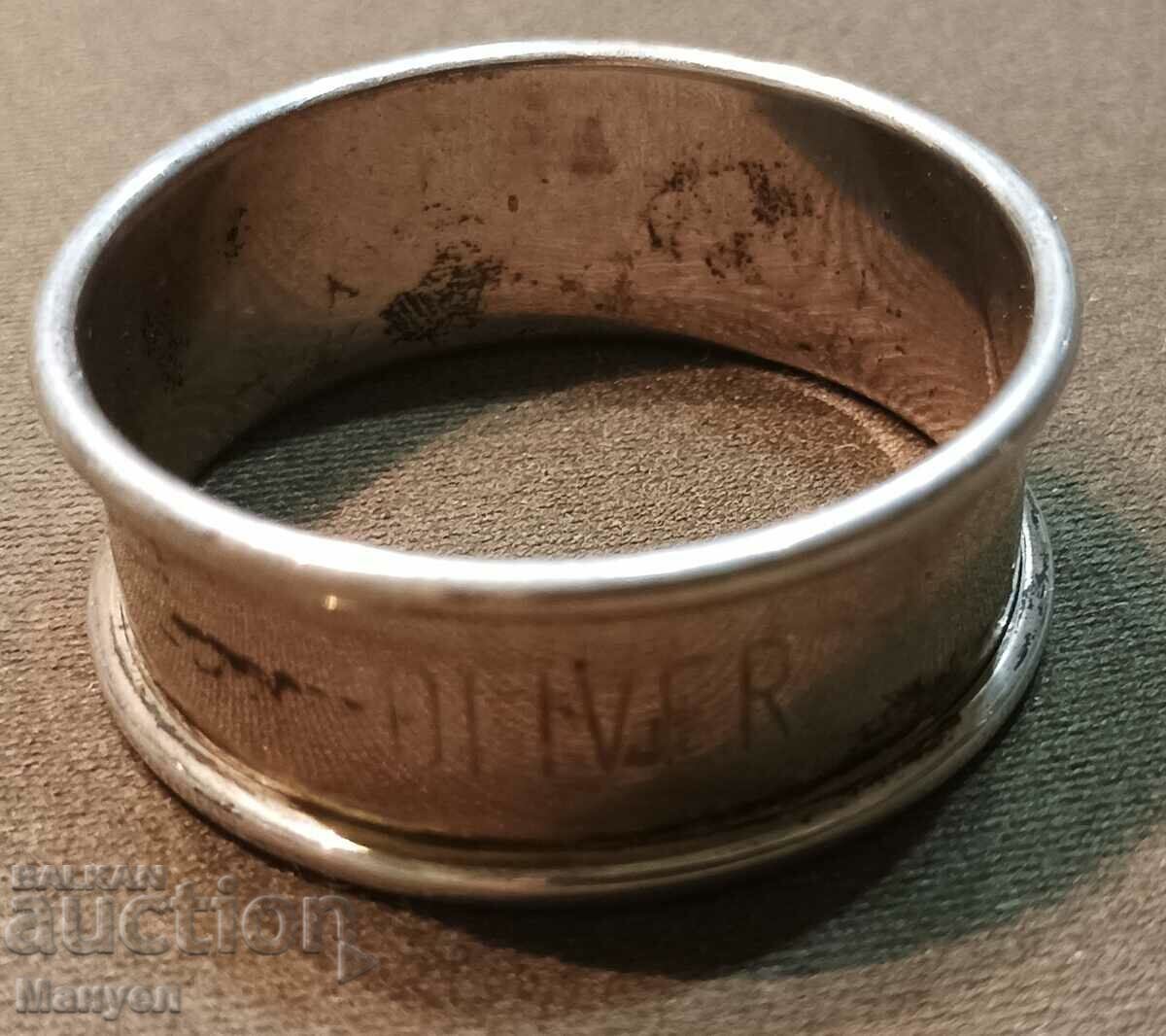 Silver ring, napkin holder.