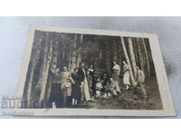 Photo Lying Men women and children in the forest