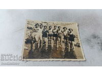 Снимка Млади момичета с ребро бански на брега на морето